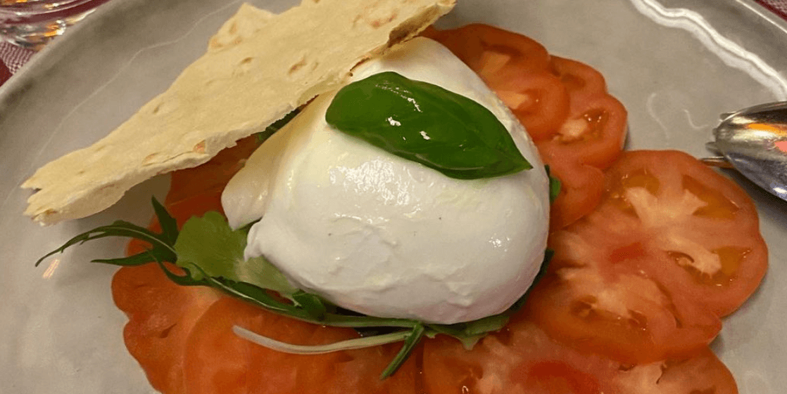 Caprese salad mozzarella di bufala tomatoes and basil